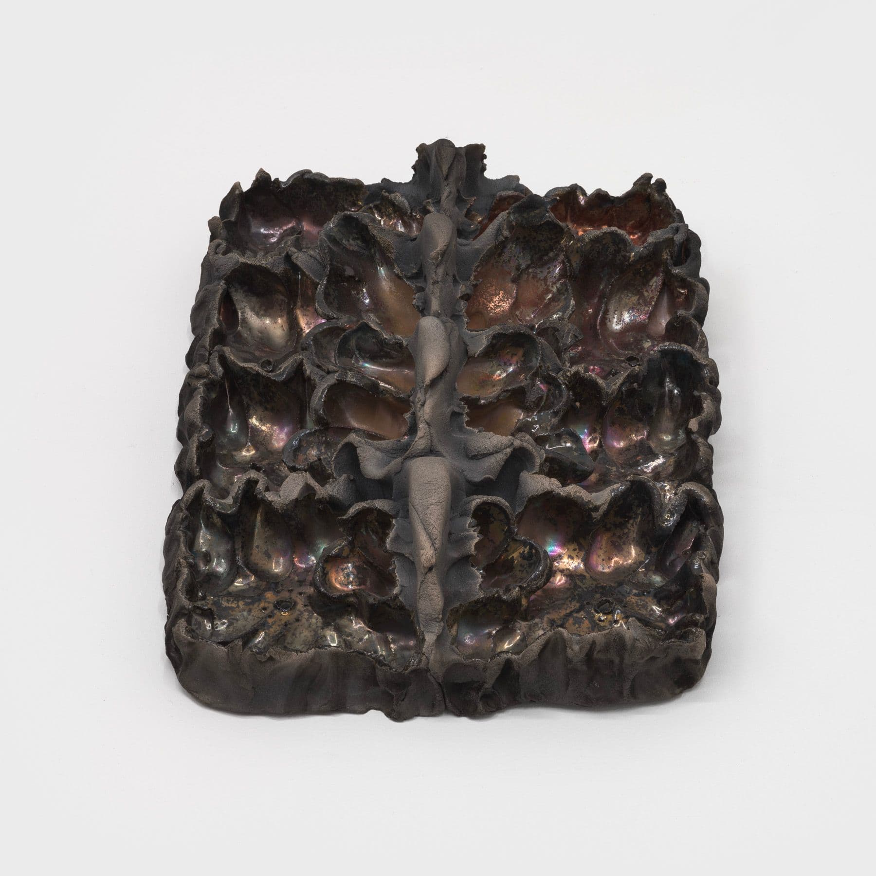 Lizette Hernández. Caricias, 2023. Raku fired 
 earthenware. 12 x 8.5 x 3 inches.