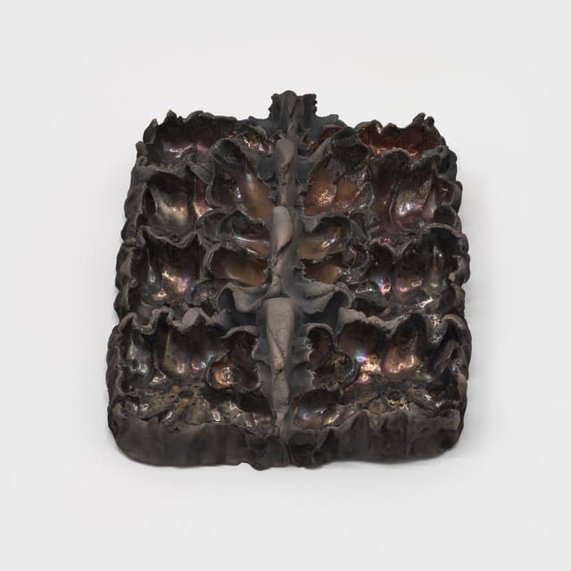 Lizette Hernández. Caricias, 2023. Raku fired 
 earthenware. 12 x 8.5 x 3 inches.