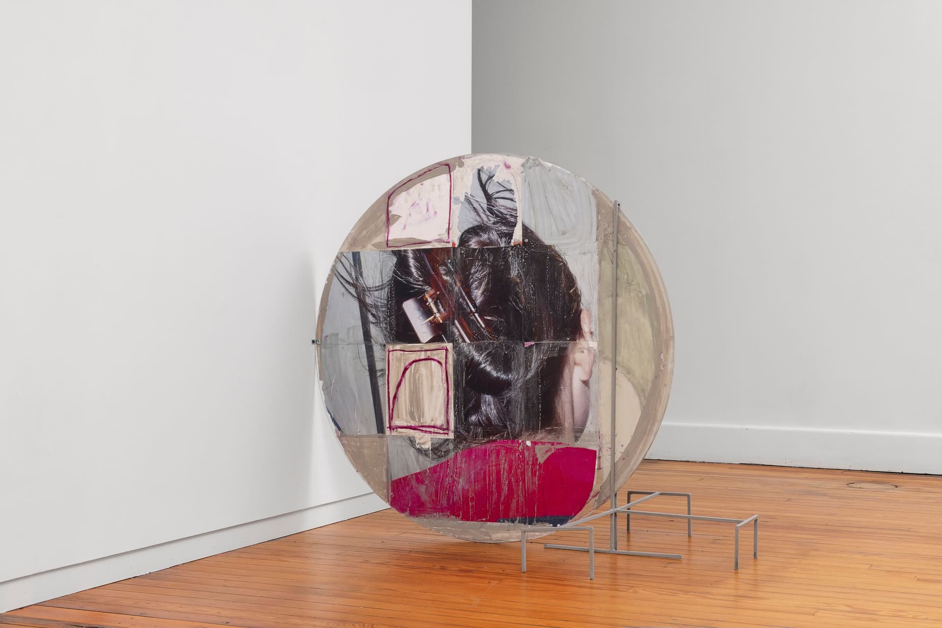 Marisa Kriangwiwat Holmes. Heads - Coin, 2024. Tiled inkjet glossy prints, oil pastel, rice and wheat paste on found glass, iron. 40 × 48 × 27 inches.