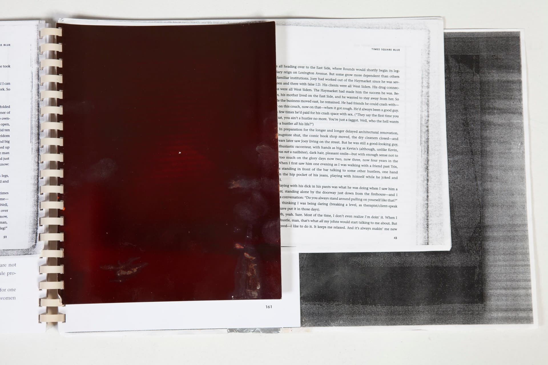 Mo Costello. Untitled (Reader), 2023. Ongoing circulation of 'Readers', made up of combination of text and image-based reproductions and found materials. Circulated locally in Jackson, Clarke and Fulton county (GA) among a circuit of convenience stores, gas stations and pharmacies as well as the flea market where Mo has maintained a working studio for the last several years. Xerox Reader: Xerox Text; Xerox Images; Toner; Ink; Gelatin Silver Contact Prints; Exposed Ortho Film (Kodalith Type III); Comb-binding; Foil Tape; Self-Inking Stamp (Lazy-Shopper); Stamp from Found Object (ROTC Recalled Footwear from J &J Flea Market); Found Magnus Speaker (J & J Flea Market). 11 x 28 x 1 inches (Open).